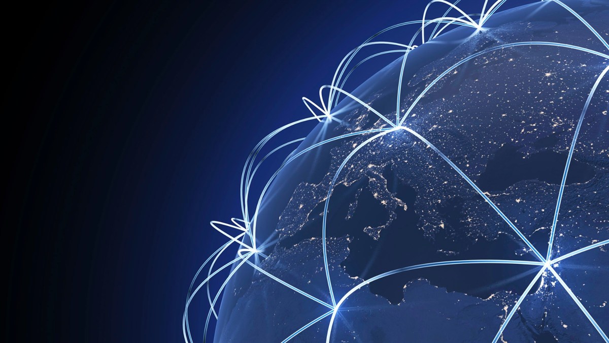 Illuminated global logistics network connecting continents